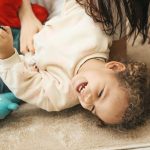 nanny supporting early childhood development activities