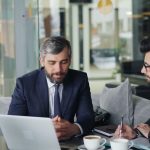 person reviewing financial documents while seeking debt counselling support for overdue accounts and legal notices