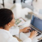 Employee organising business documents using digital metadata