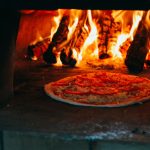 Pizza oven showing high cooking temperature